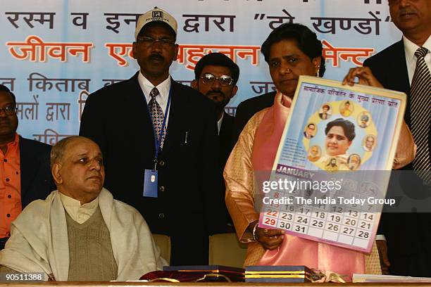 Mayawati, Vice-President of Bahujan Samaj Party and and former UP Chief Minister with Kanshi Ram, Bahujan Samaj Party founder, celebrating her 50th...