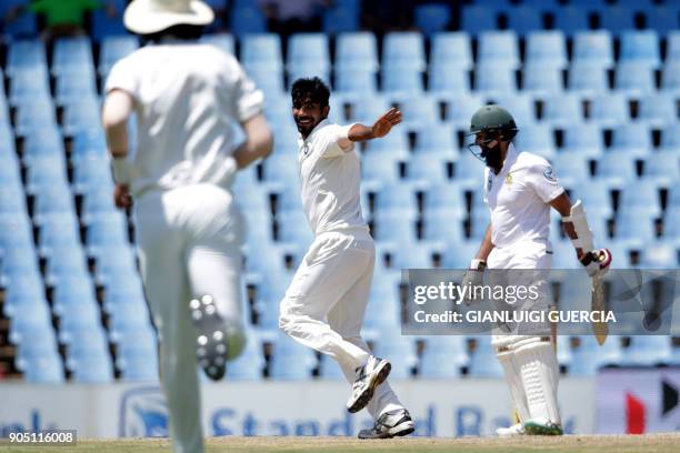 Indian bowler jasprit Bumrah celebrates the dismissal of South African batsman Hashim Amla during the third day of the second Test cricket match...