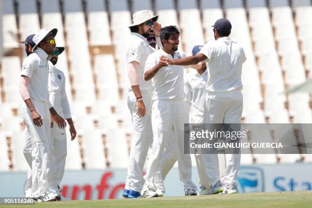 Indian bowler Jasprit Bumrah celebrates the dismissal of South African batsman Hashim Amla during the third day of the second Test cricket match...
