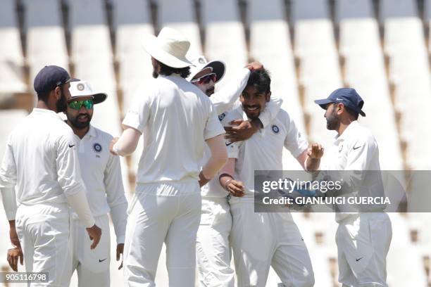 Indian bowler Jasprit Bumrah celebrates the dismissal of South African batsman Hashim Amla during the third day of the second Test cricket match...