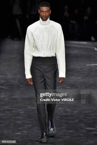 Model walks the runway at the Neil Barrett show during Milan Men's Fashion Week Fall/Winter 2018/19 on January 13, 2018 in Milan, Italy.