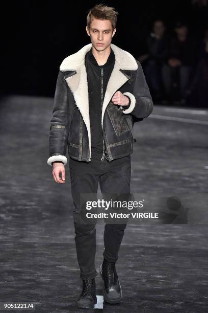 Model walks the runway at the Neil Barrett show during Milan Men's Fashion Week Fall/Winter 2018/19 on January 13, 2018 in Milan, Italy.