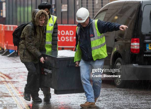 Building subcontractors, working for MJ Hillson Ltd., remove tools from the Barts Square development, operated by Carillion Plc, in London, U.K., on...