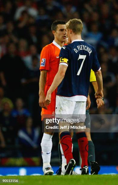 Darren Fletcher of Scotland reacts with Robin van Persie of Netherlands during the FIFA 2010 World Cup Group 9 Qualifier match beteween Scotland and...
