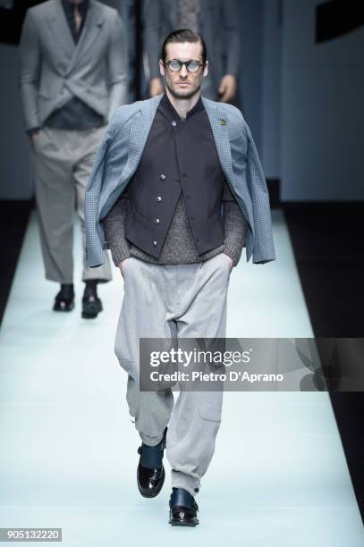 Model walks the runway at the Giorgio Armani show during Milan Men's Fashion Week Fall/Winter 2018/19 on January 15, 2018 in Milan, Italy.