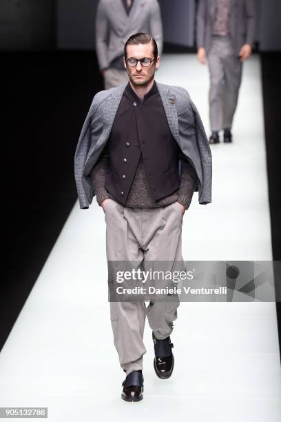 Model walks the runway at the Giorgio Armani show during Milan Men's Fashion Week Fall/Winter 2018/19 on January 15, 2018 in Milan, Italy.