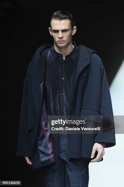 Model walks the runway at the Giorgio Armani show during Milan Men's Fashion Week Fall/Winter 2018/19 on January 15, 2018 in Milan, Italy.