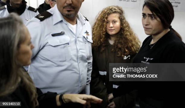 Sixteen-year-old Palestinian Ahed Tamimi , a well-known campaigner against Israel's occupation, stands for a hearing in the Israeli military court at...