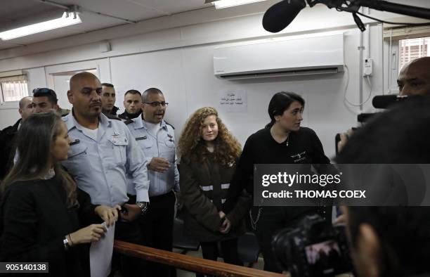 Sixteen-year-old Palestinian Ahed Tamimi , a well-known campaigner against Israel's occupation, stands for a hearing in the Israeli military court at...