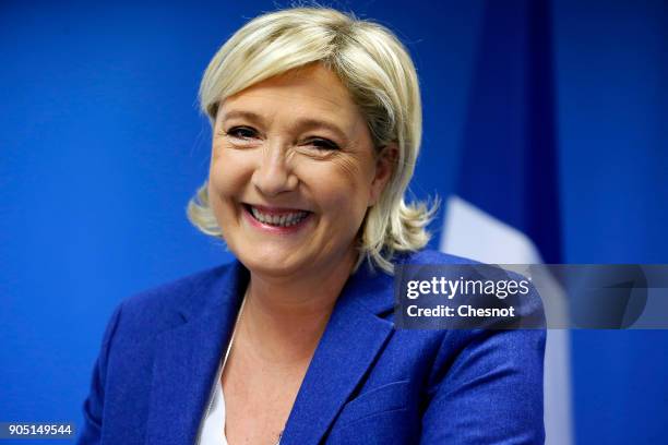 French far-right National Front political party leader, Marine Le Pen delivers her New Year wishes to the media at the party's headquarters on...