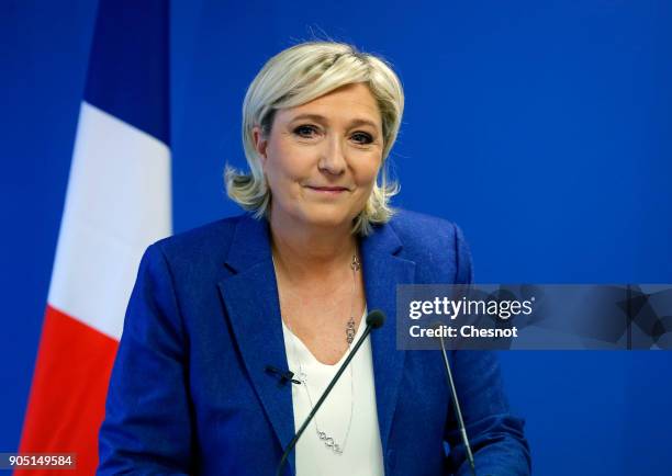 French far-right National Front political party leader, Marine Le Pen delivers her New Year wishes to the media at the party's headquarters on...