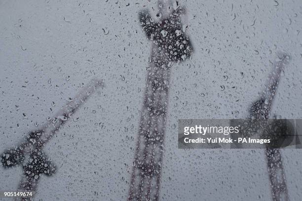 Cranes seen through raindrops at a Carillion construction site in central London, as the Government said all Carillion staff should still come to...