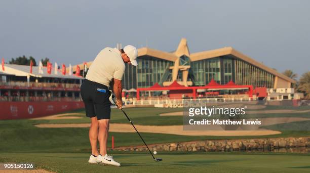 Rory McIlroy of Northern Ireland plays his second shot from the 18th fairway during a practice round ahead of Abu Dhabi HSBC Golf Championship at Abu...