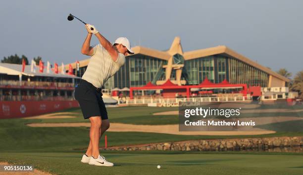 Rory McIlroy of Northern Ireland plays his second shot from the 18th fairway during a practice round ahead of Abu Dhabi HSBC Golf Championship at Abu...