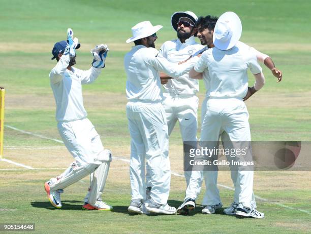 Jasprit Bumrah of India celebrates the wicket of Hashim Amla of the Proteas with his team mates during day 3 of the 2nd Sunfoil Test match between...