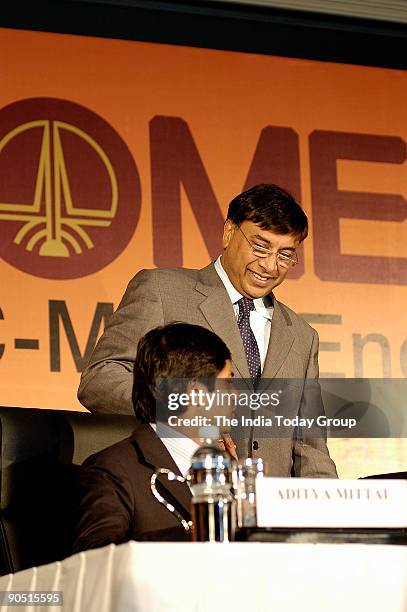 Mittal Chairman and CEO Mittal Steel and Director of ONGC Mittal Energy Ltd with his son, Aditya Mittal during a press conference, in Delhi, India on...