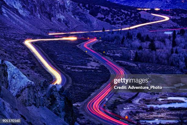 gypsum colorado with i-70 interstate highway at dusk - interstate 70 stock pictures, royalty-free photos & images