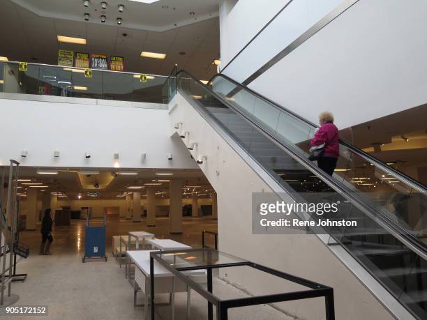 Sears Closing Final .A shopper rides up to the second floor where the liquidation sales were happening. The Sears at Erin Mills Town Centre close out...