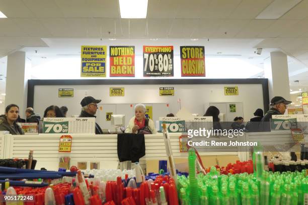 Sears Closing Final . Brenda Lazenbury waits to check out under the sale signs. The Sears at Erin Mills Town Centre close out sales. It is one of the...