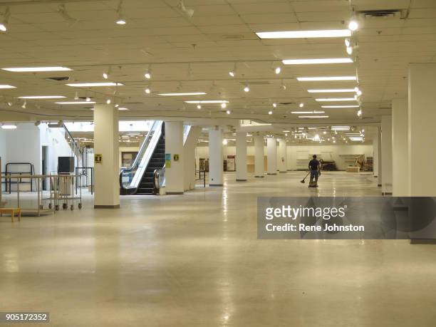 Sears Closing Final . A worker pulls his vacuum on the empty first floor. The Sears at Erin Mills Town Centre close out sales. It is one of the last...