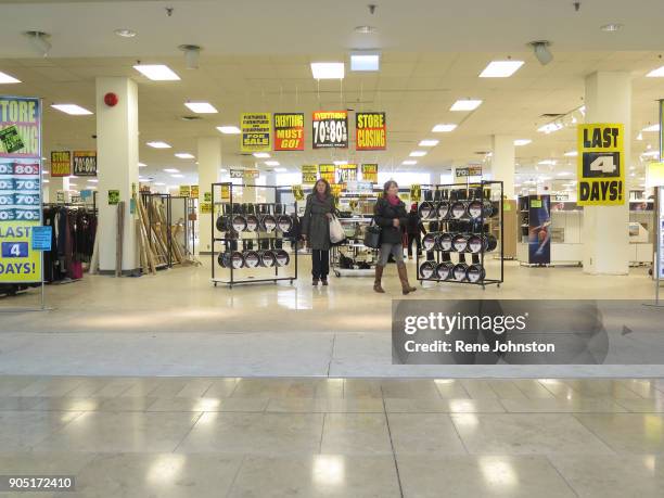 Sears Closing Final . Shoppers leave amongst the sale signs. The Sears at Erin Mills Town Centre close out sales. It is one of the last 32 Sears...