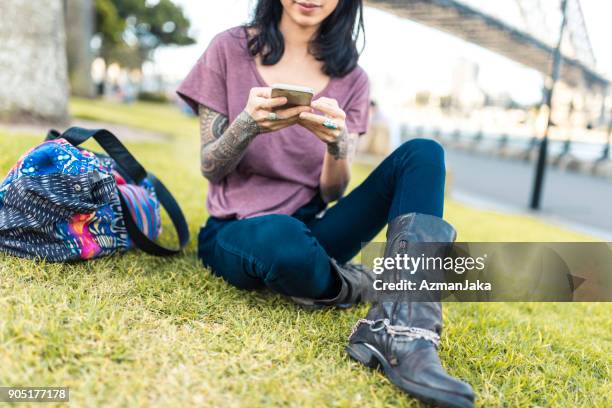 asian woman relaxing and using smart phone in sydney - 2017 243 stock pictures, royalty-free photos & images