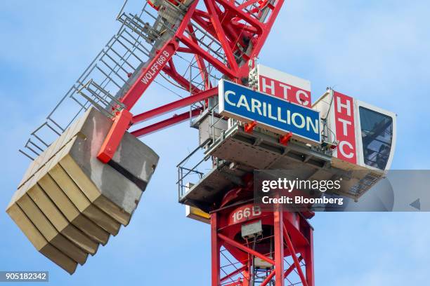 Sign hangs from a crane working on the Arundel Great Court development, operated by Carillion Plc, in London, U.K., on Monday, Jan. 15, 2018....