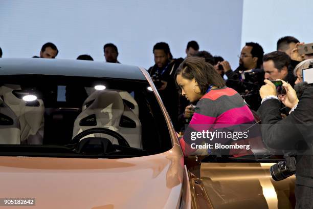 Members of the media photograph a Toyota Motor Corp. Lexus LF-1 Limitless crossover concept vehicle during the 2018 North American International Auto...