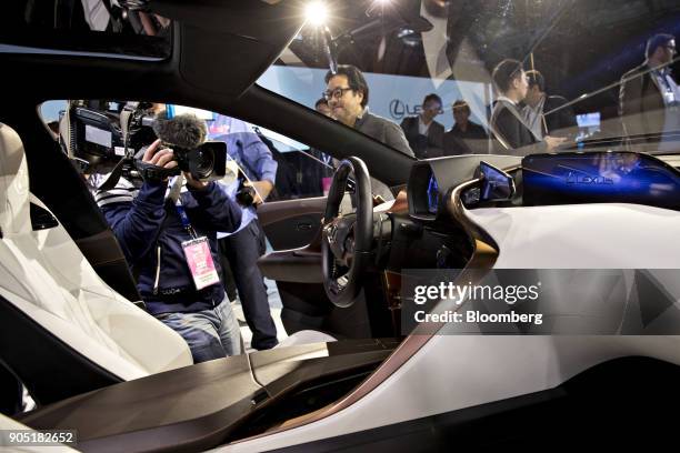 Member of the media takes video of a Toyota Motor Corp. Lexus LF-1 Limitless crossover concept vehicle during the 2018 North American International...