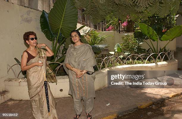 Indrani Malkani and Farida Agboatwala near the flowerpots made of recycled garbage bricks at Malabar Hill in the Western Indian city of Mumbai on...