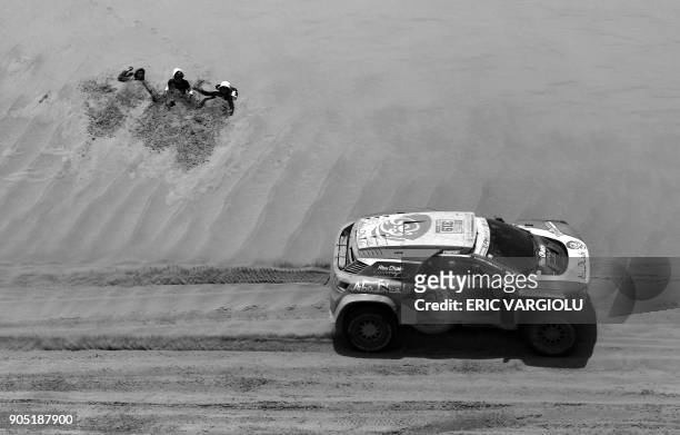 Sheikh Khalid Al Qassimi of United Arab Emirates, with his co-driver Xavier Panseri of France, steers his Peugeot during Stage 8 of the 2018 Dakar...