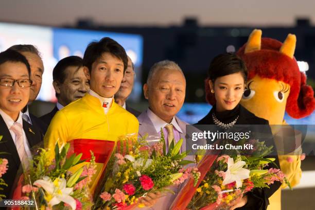 Jockey Yutaka Take and owner Sachiaki Kobayashi celebrate after Copano Rickey winning the JBC Classic at Ohi Racecourse in Tokyo, Japan on November...