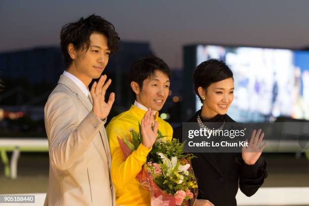 Jockey Yutaka Take, Ayame Goriki and Takumi Saito at the presentation ceremony after Copano Rickey winning the JBC Classic at Ohi Racecourse in...