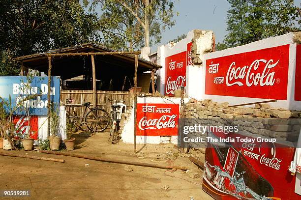 View of Coca Cola Hoardings / Advertisment Display / Wall Painting on road side Dhaba / hotel, in Gurgaon, India.
