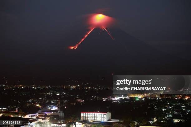 Lava from Mayon volcano is seen as it erupts in Legazpi on January 15, 2018. The Philippines raised the alert level for the country's most active...