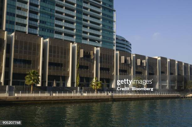 New residential apartment blocks stand in the Al Muneera gated enclave, developed by Carillion Plc and Al-Futtaim Group, along the Al Raha waterfront...