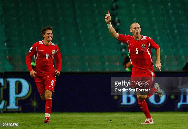 Wales players Aaron Ramsey and goalscorer James Collins celebrate after the first Wales goal during the FIFA 2010 World Cup Qualifier between Wales...