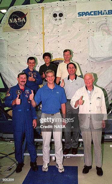 The STS-95 crew takes time out from SPACEHAB familiarization activities at the SPACEHAB Payload Processing Facility, Cape Canaveral, to pose for a...