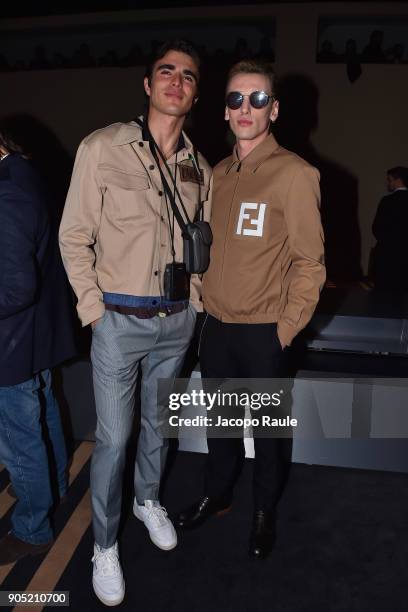 Guest and Jamie Campbell Bower attends the Fendi show during Milan Men's Fashion Week Fall/Winter 2018/19 on January 15, 2018 in Milan, Italy.