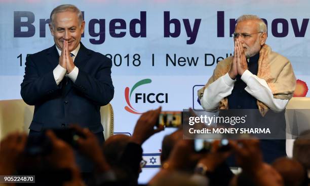 Indian Prime Minister Narendra Modi and Israeli Prime Minister Benjamin Netanyahu greet during the India-Israel Business Summit in New Delhi on...