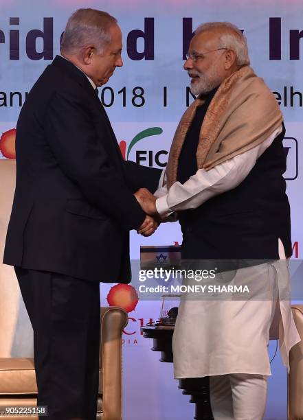 Indian Prime Minister Narendra Modi shakes hands with Israeli Prime Minister Benjamin Netanyahu during the India-Israel Business Summit in New Delhi...