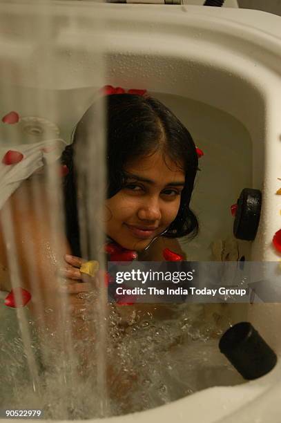 Model Parul in Hydrotherapy tub at Leela Palace in Bangalore, Karnataka, India