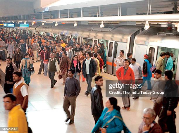 People coming out from Metro Train at Connaught Place Metro Station, New Delhi, India.