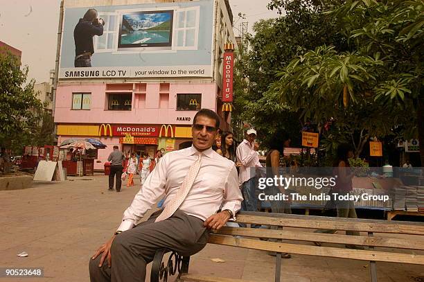 Rajan Mittal, Joint Managing Director, Bharti Tele Ventures Ltd, poses at outdoor location in Delhi, India. Potrait, Sitting