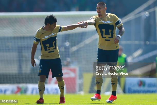 Nicolas Castillo of Pumas celebrates with teammate Matias Alustiza after scoring the first goal of his team during the second round match between...