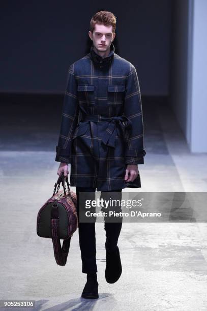 Model walks the runway at the Hunting World show during Milan Men's Fashion Week Fall/Winter 2018/19 on January 15, 2018 in Milan, Italy.