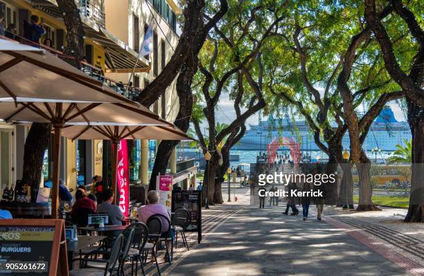 people in funchal,  madeira with view to cruise ship and restaurants - funchal imagens e fotografias de stock