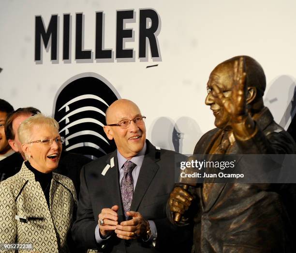 Former Los Angeles Kings play-by-play announcer Bob Miller and his wife Judy Miller, react during his statue unveiling ceremony before the game...