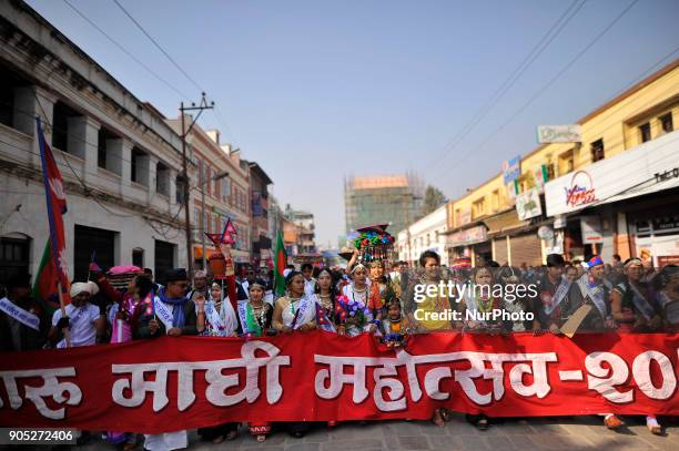 Nepalese Tharu community people in a traditional attire during prade of the Maghi festival celebrations or the New Year of the Tharu community at...