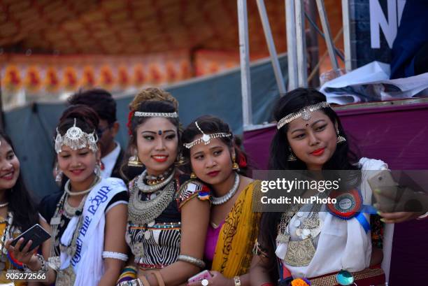 Nepalese Tharu community girls take selfie picture during parade of the Maghi festival celebrations or the New Year of the Tharu community at...